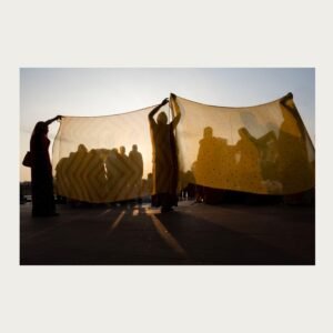 Women in Haridwar captured in intimate setting – fine art photograph by Debrani Das