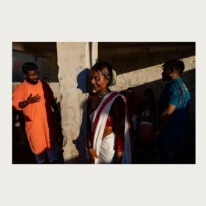 Woman between two men forming triangle composition – Kolkata photograph